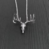 This pendant is the most realistic whitetail deer skull necklace you will find on Etsy. Made of sterling silver with an oxidized finish in the recesses. It measures 1-1/8" wide and 1" tall.