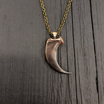Large metal claw pendant on chain, polished detail | Moon Raven