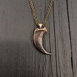 Large metal claw pendant on chain, polished detail | Moon Raven