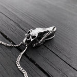 Black & white photo of necklace with skull pendant | Moon Raven