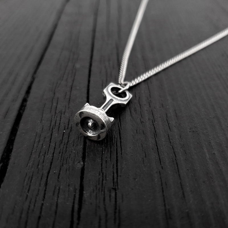 This piston and rod pendant measures 1” Long by 3/8&quot; wide. The precisely detailed 3D rod and piston are cast in one solid piece of sterling silver.