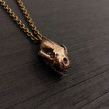 This 1&quot; bronze wolverine skull pendant exhibits exceptional realistic detail with the jaw slightly ajar.
