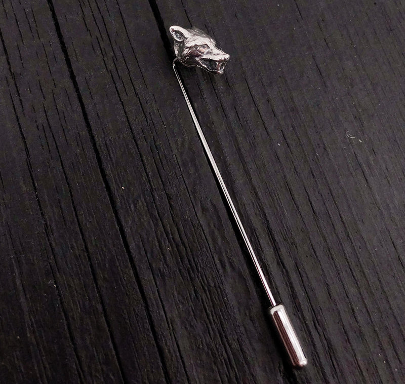 Sterling silver wolf head stickpin on black textured surface | Moon Raven